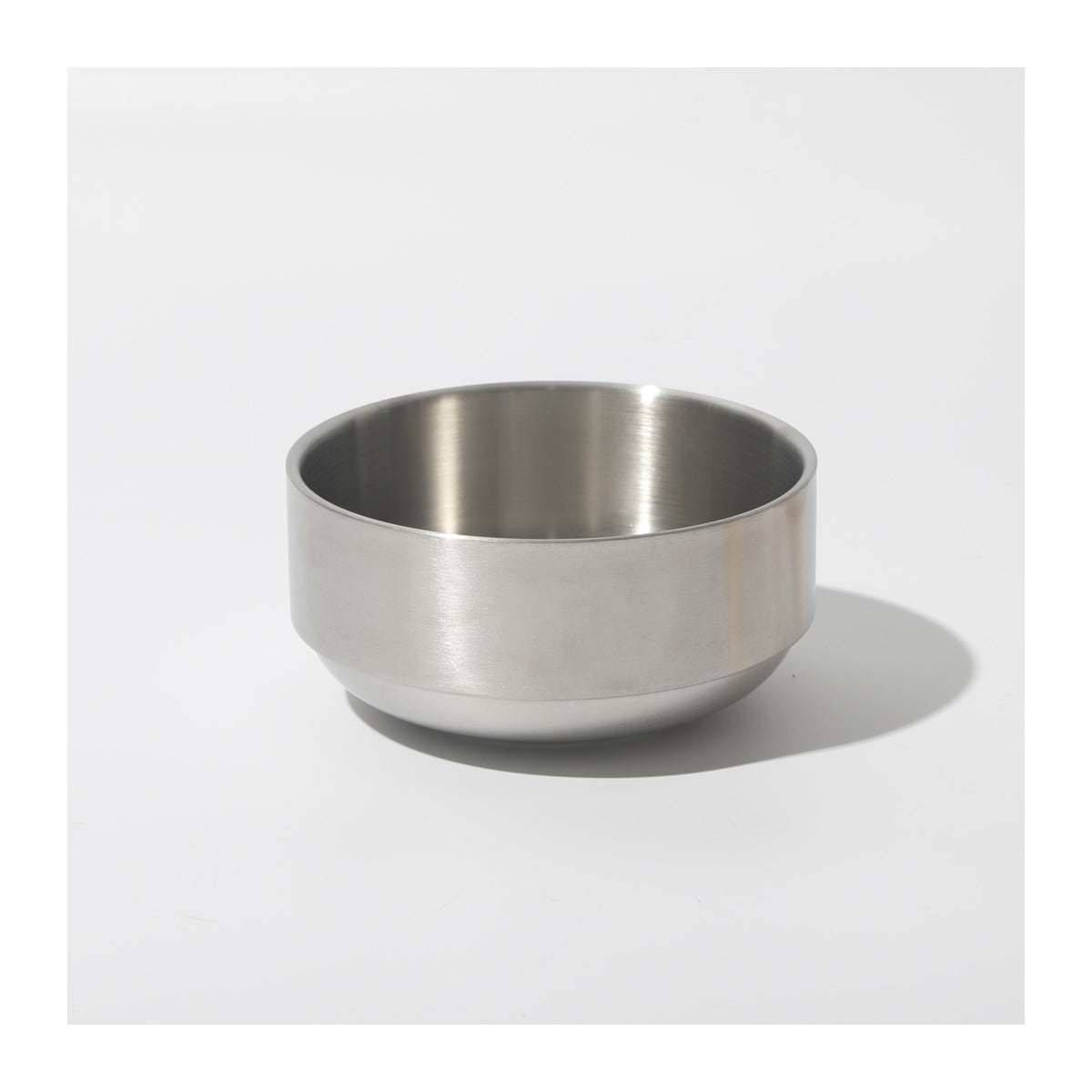 Stainless Steel Cat Bowl On A Raised Wooden Stand To Prevent Tipping